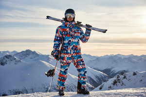Man posing with snow gear